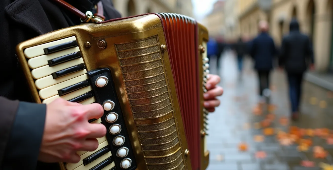 Street musician playing accordion on cobblestone street with autumn leaves
